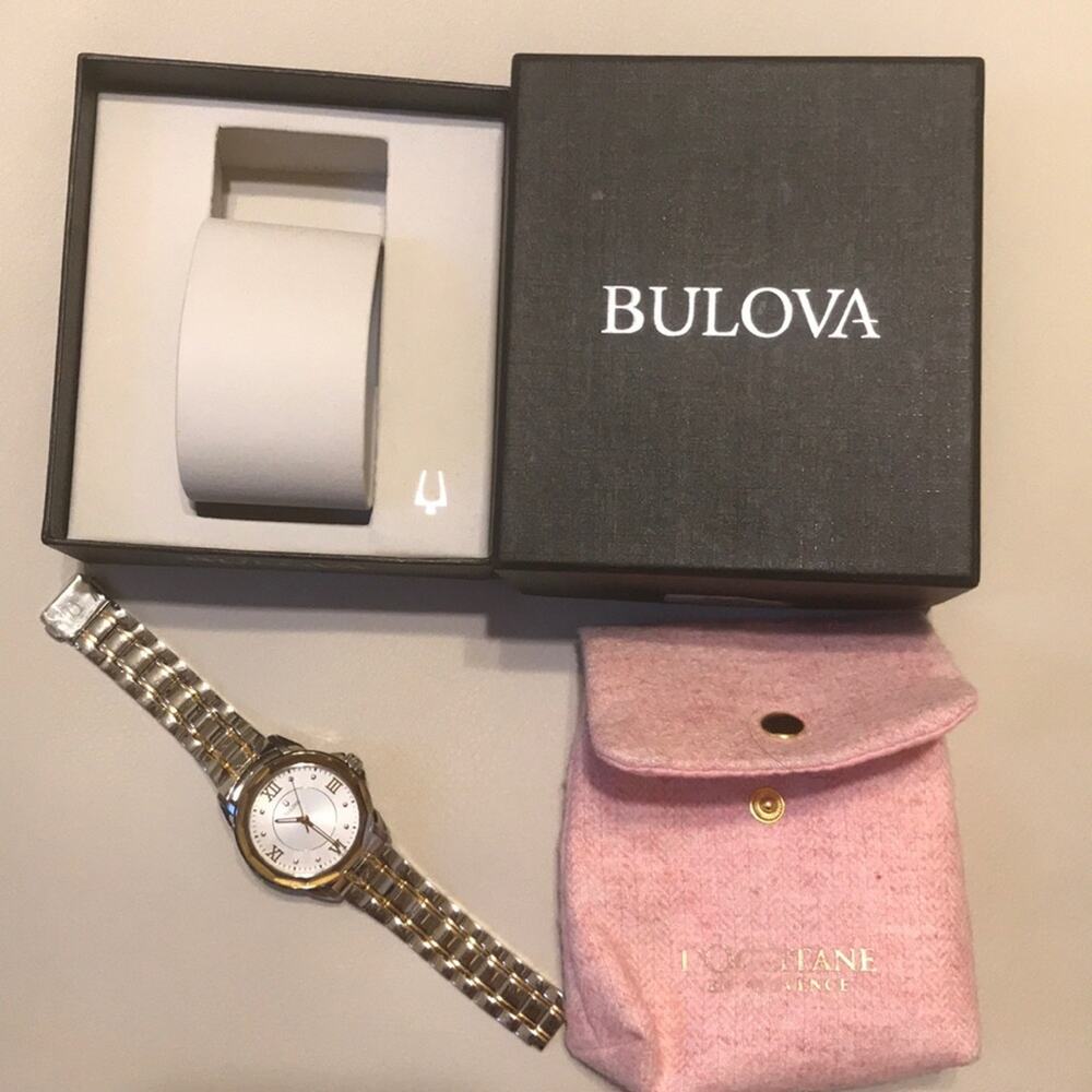 Bulova gold tone Stainless Steel Watch and press